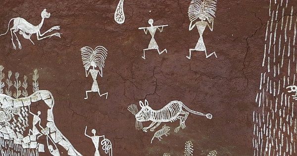 White skeletal figures and animals drawn across a dark brown surface